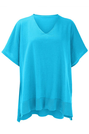 Cerulean knit poncho top with V-neck, short sleeves, and ribbed hem detail.