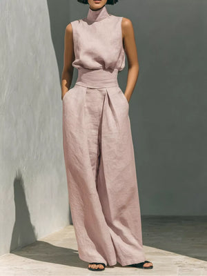 Pink linen turtleneck sleeveless top and wide-leg pants set with belted waist