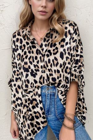 Leopard print oversized button-down blouse with a relaxed fit and collared neckline.