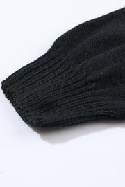 Black acrylic knit cardigan sleeve detail with ribbed cuff