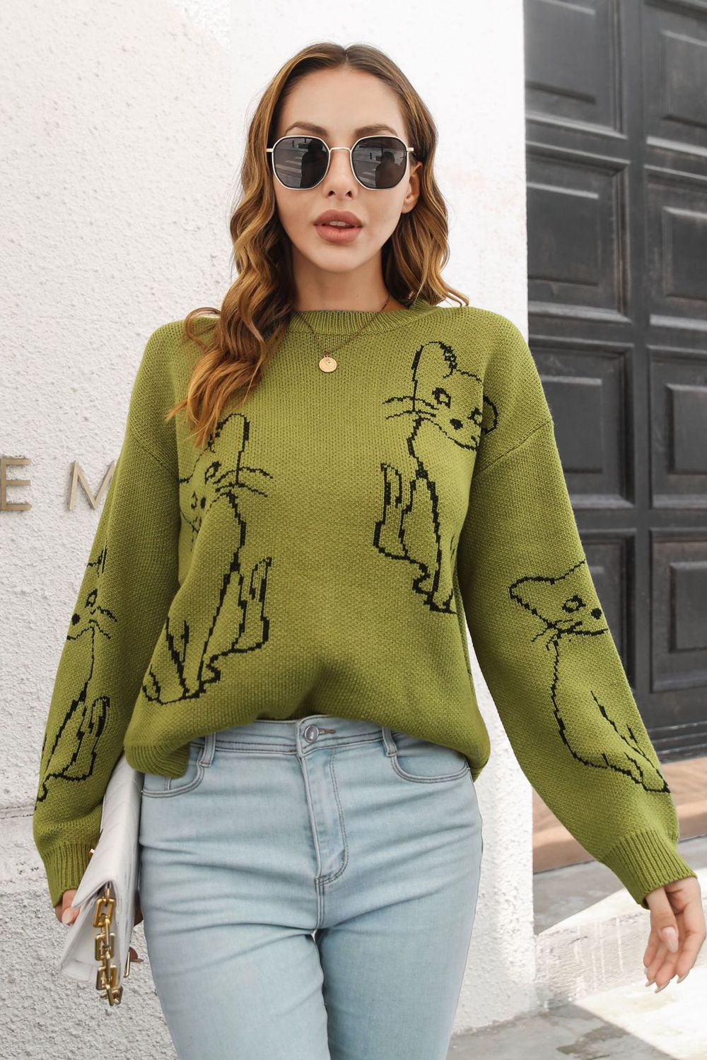 Matcha green acrylic sweater with black cat intarsia knit pattern, crew neck, and long sleeves.