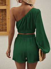 Dark green textured one-shoulder crop top and cuffed shorts set