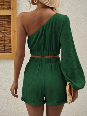 Dark green textured one-shoulder crop top and cuffed shorts set