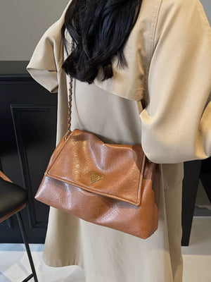 Brown flap shoulder bag with chain detail and triangle logo
