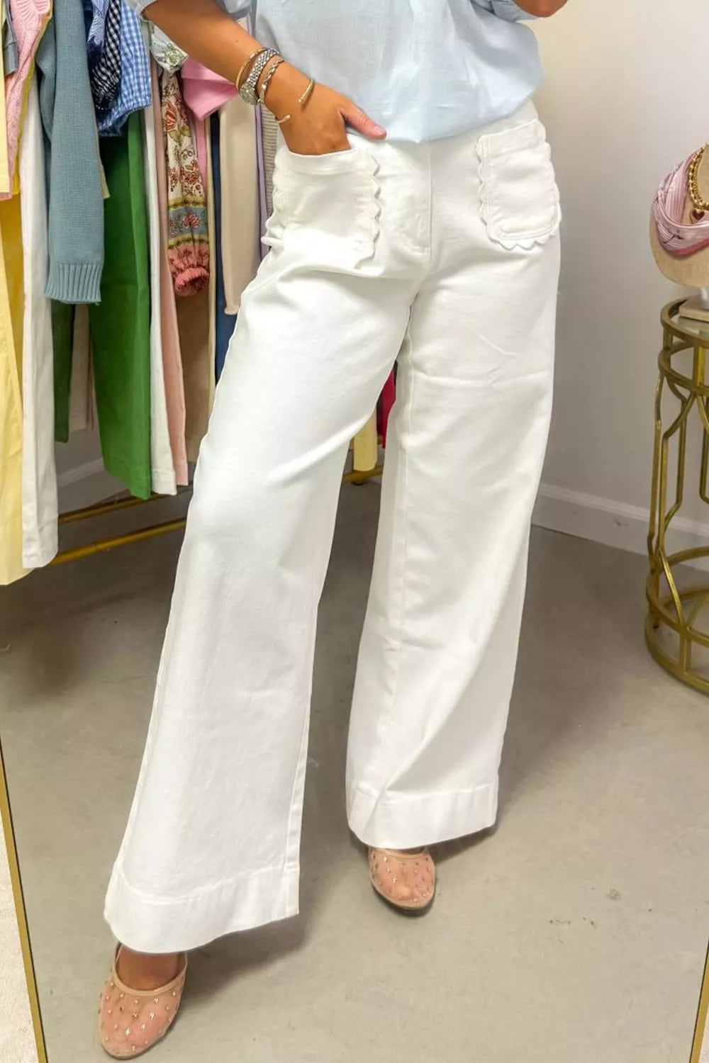 White denim wide-leg jeans with scalloped pocket details