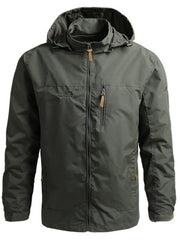 Plus-size green hooded windbreaker jacket with zip pockets and drawstring hood.