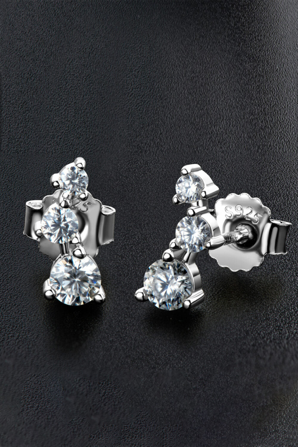 Silver cluster stud earrings with three round moissanite stones each