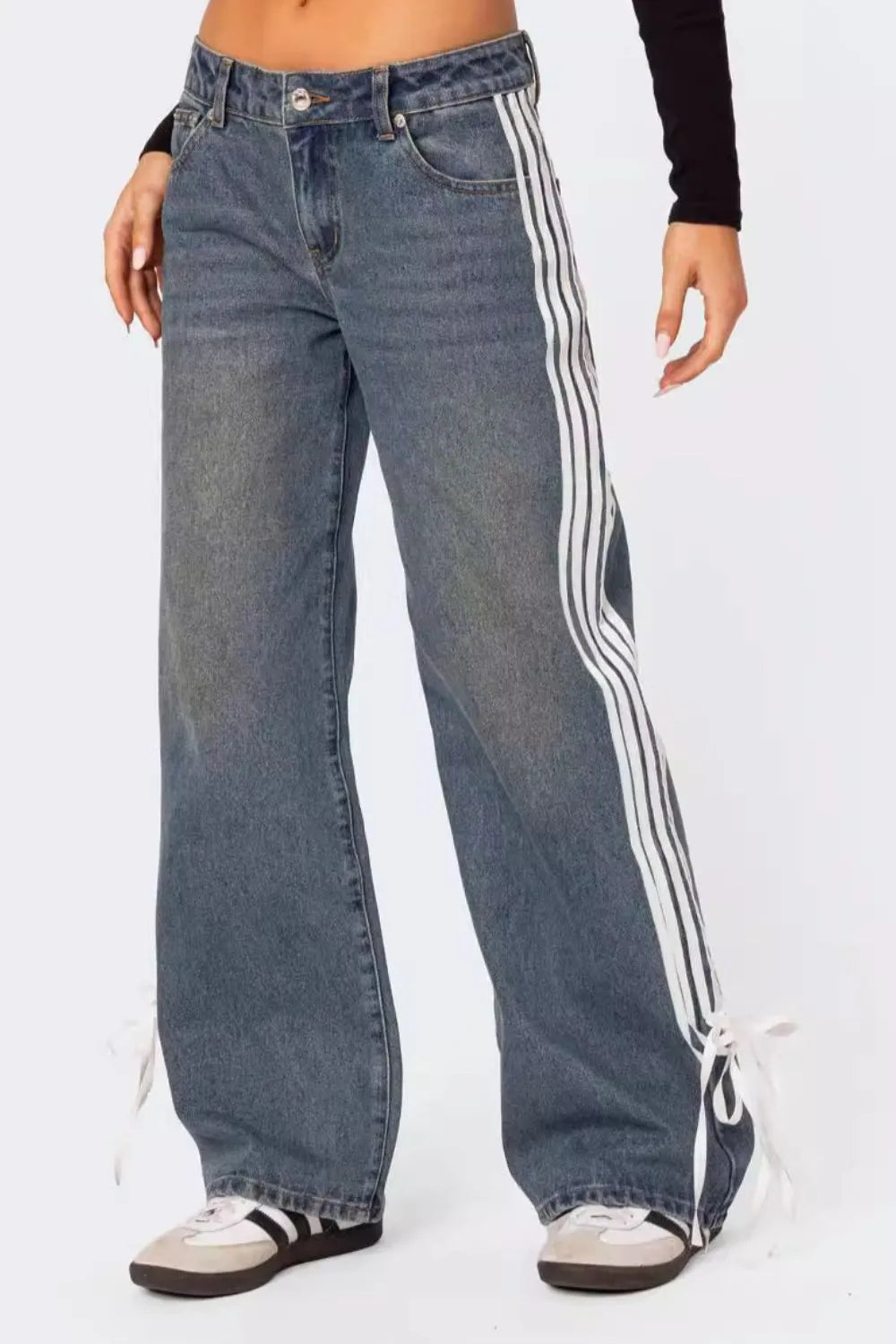 Light blue denim wide-leg trousers with white side stripes and tie ankles