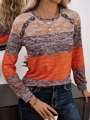 Marled stripe knit sweater with button shoulder detail in orange and brown tones.