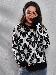 Black acrylic floral jacquard knit sweater with crew neck and long sleeves.
