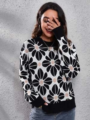 Black acrylic floral jacquard knit sweater with crew neck and long sleeves.