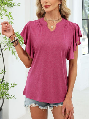 Wine red tee with ruffled sleeves and notched V-neck, styled with denim shorts.