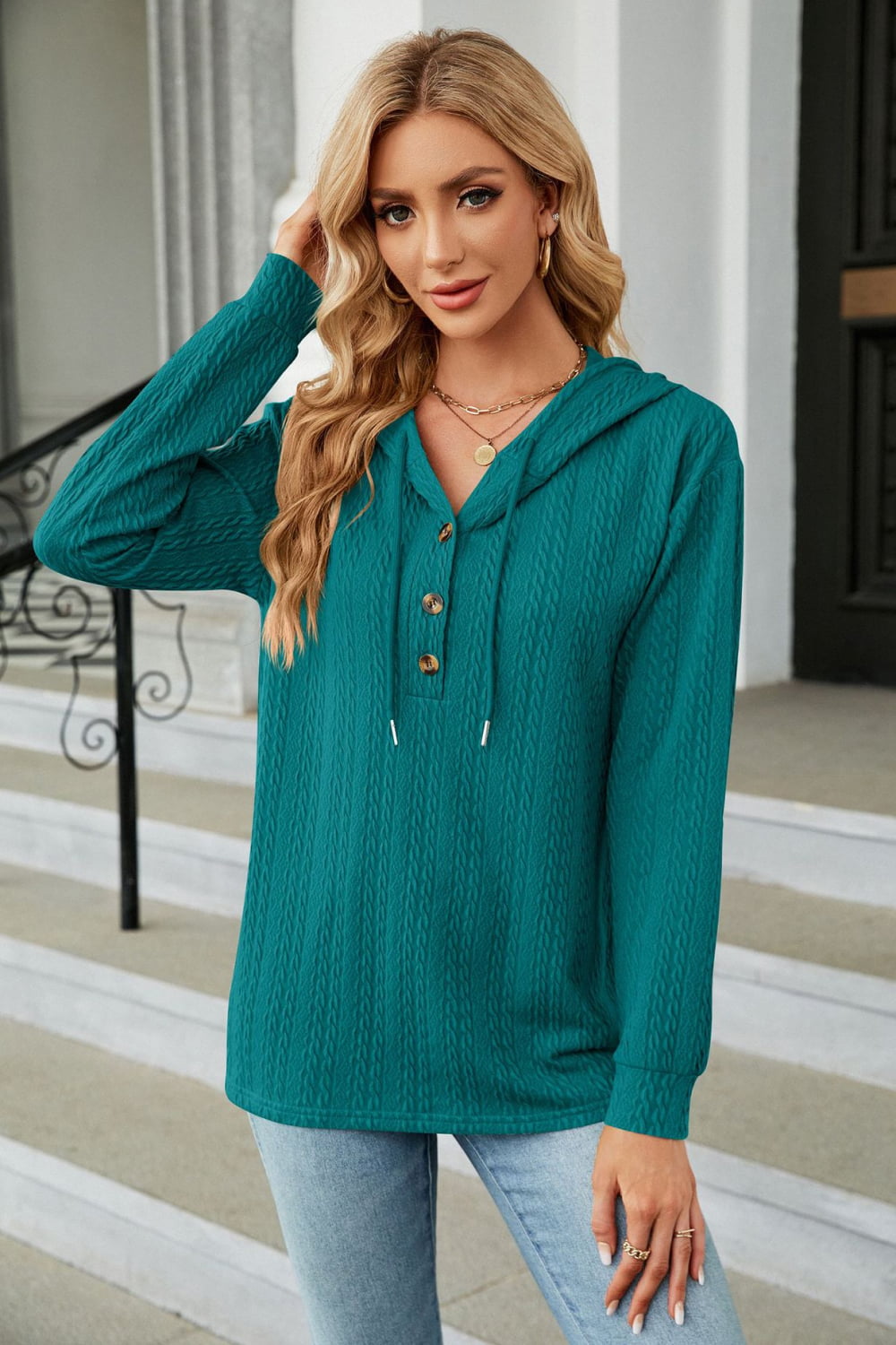 Textured henley hooded knit top in deep teal with button detail and drawstring hood.