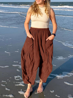 Brown linen balloon trousers with cargo pockets and elastic waist
