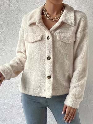 Beige teddy bear textured shacket with button front and patch pockets.