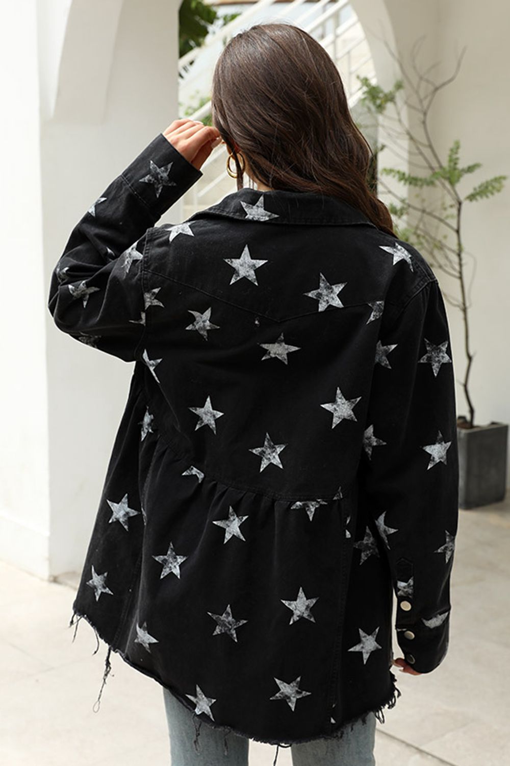 Black denim shirtdress with allover white stars and raw hem detail