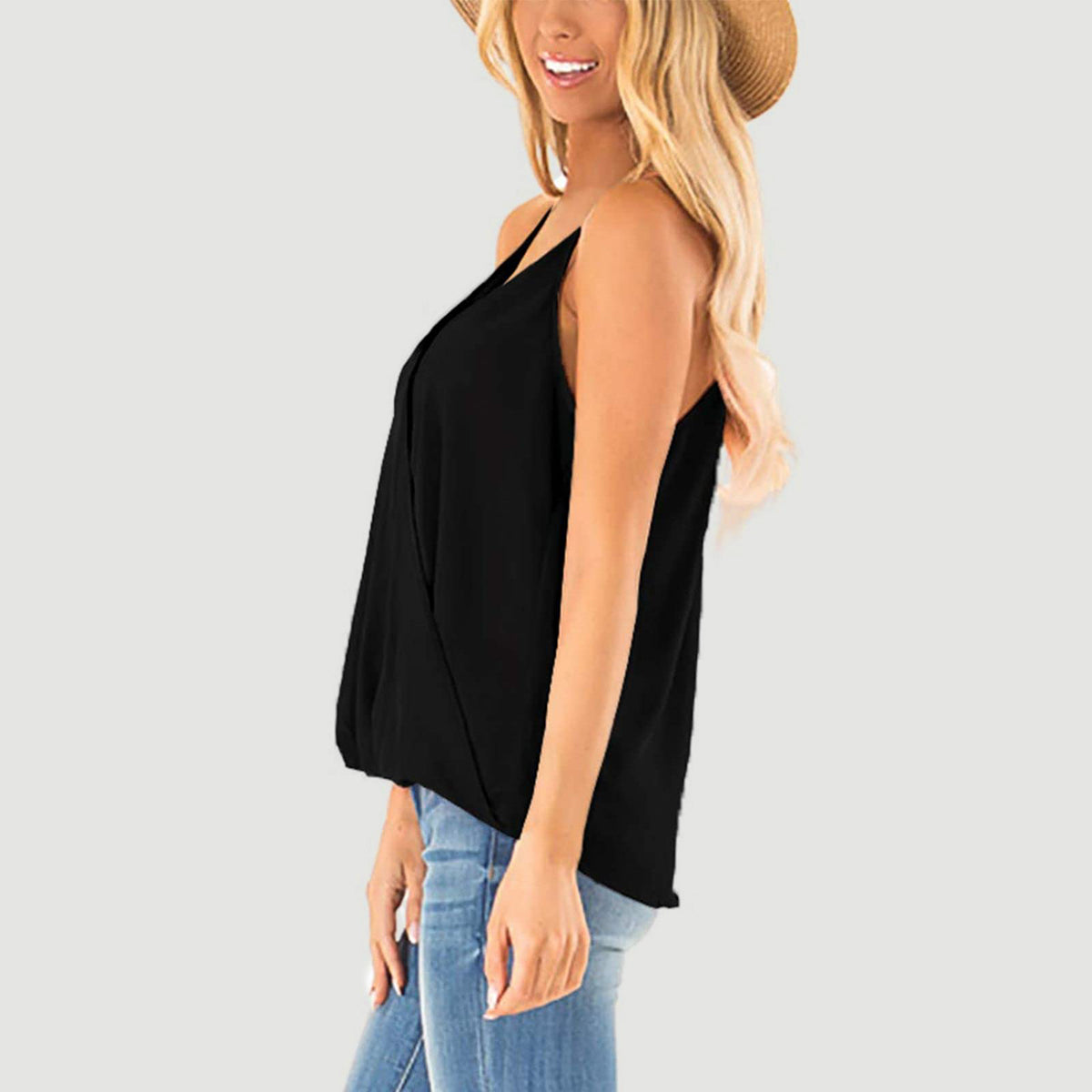 Black draped crossover halter cami with spaghetti straps.