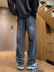 Dark gray vintage wash straight-leg jeans with drawstring waist and classic back pockets.