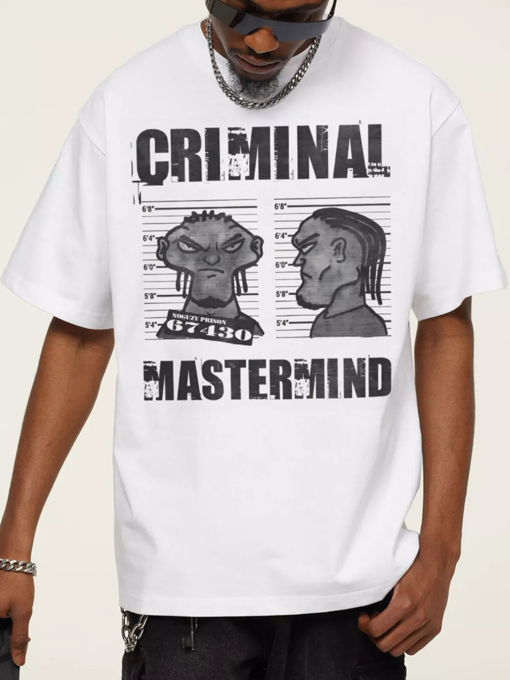 White cotton graphic tee with bold "CRIMINAL MASTERMIND" print and cartoon mugshot.