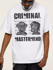 White cotton graphic tee with bold "CRIMINAL MASTERMIND" print and cartoon mugshot.