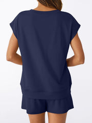 Navy V-neck top with cap sleeves and drawstring shorts set.