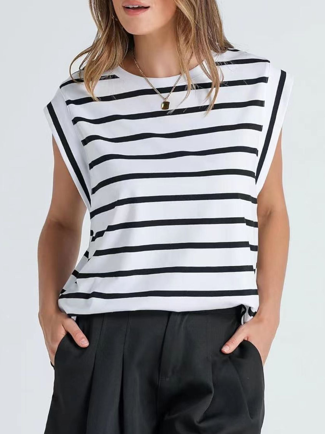 Classic striped sleeveless tank top in white and black.