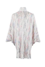 Textured knit cape in ivory with multicolor stripes and fringe trim