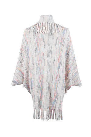 Textured knit cape in ivory with multicolor stripes and fringe trim