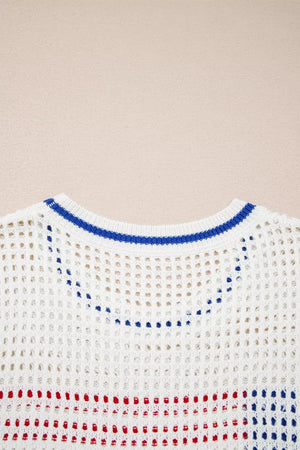White eyelet knit sweater with blue neckline trim and red/blue stripes.