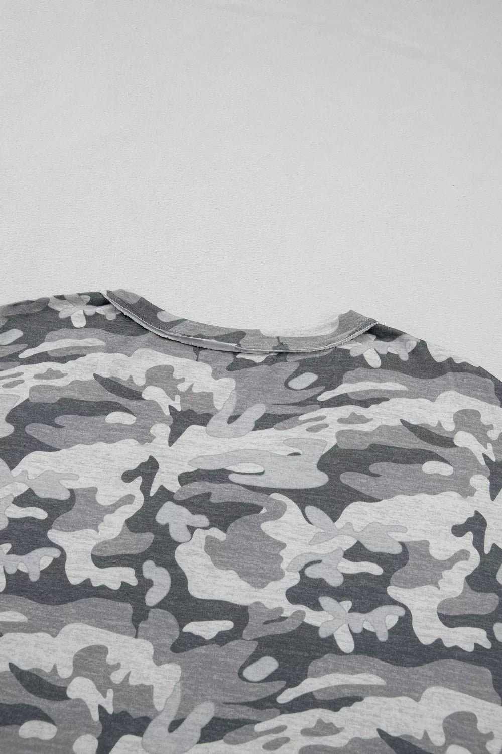 Camouflage V-neck relaxed tee with grey and black pattern