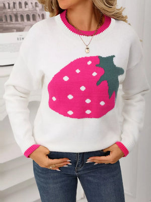 White knit sweater with large pink strawberry graphic and pink trim