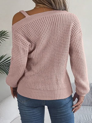 Blush pink one-shoulder knit sweater with buckle detail, 100% acrylic, casual asymmetrical cut.