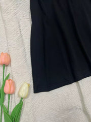 Black scoop neck cami detail with stitched hem