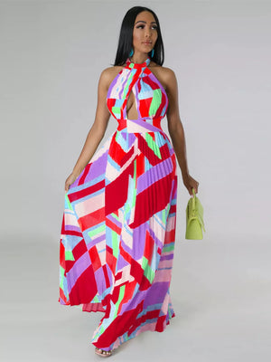 Halter neck pleated maxi dress with bold geometric print and defined waistband.