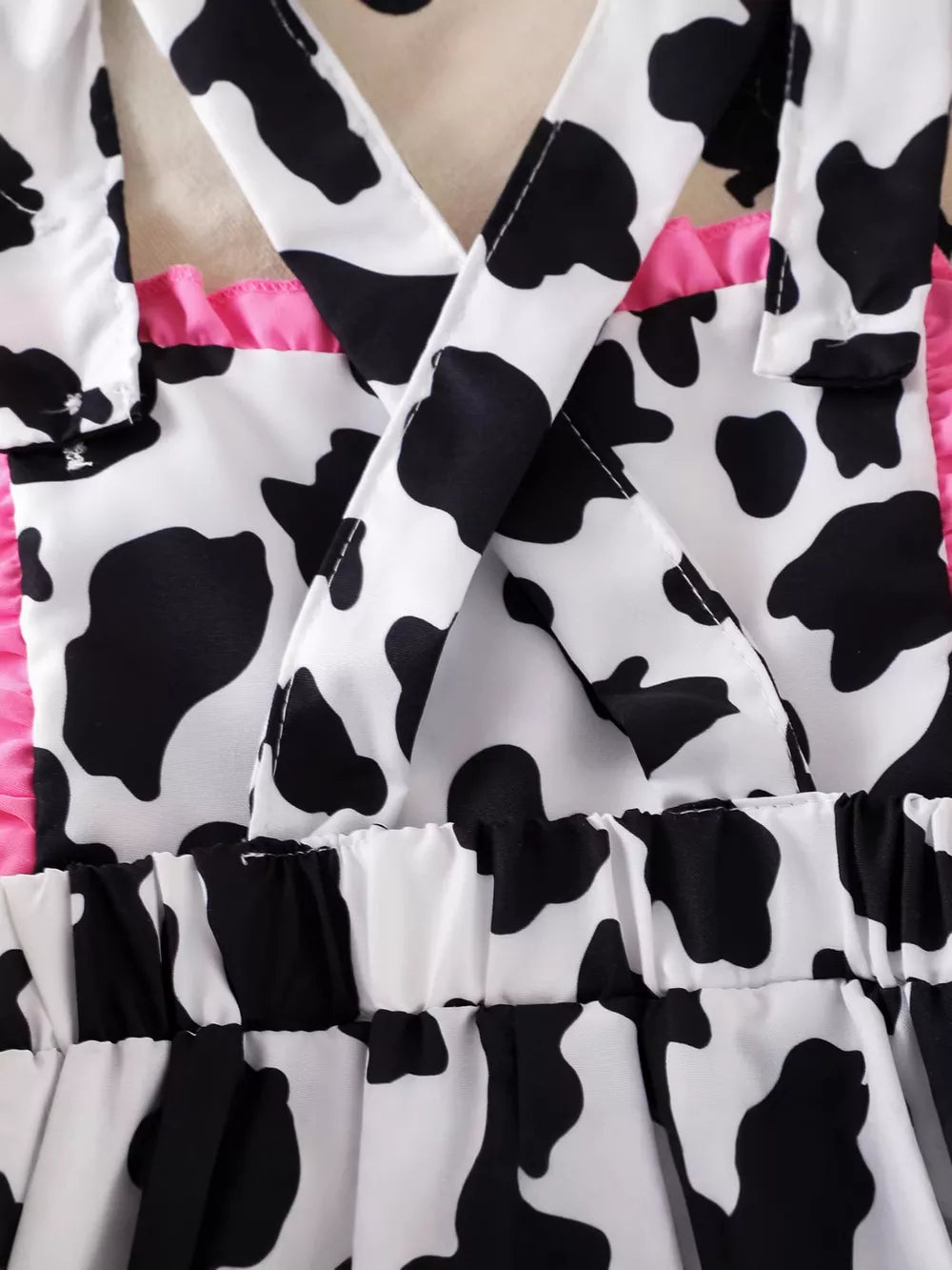 Children's Cow Print Ruffle Jumpsuit in Brown And White, model styling view