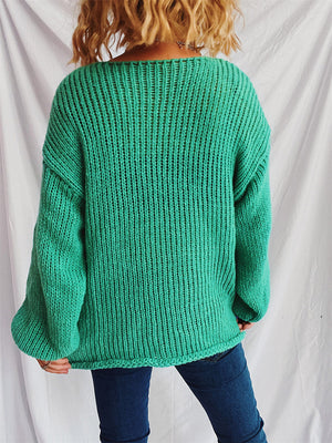 Turquoise open-knit acrylic boatneck pullover sweater with slouchy fit and ribbed details.
