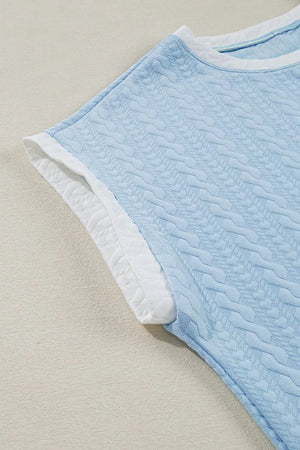 Light blue cable knit loungewear set top with white contrast trim and textured pattern.