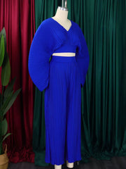 Royal blue pleated two-piece set with V-neck crop top and wide-leg pants