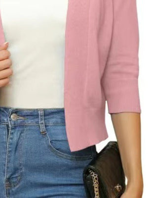 Dusty Pink open-front cropped cardigan with elbow sleeves, styled with a white top and jeans.