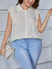 Light yellow collared blouse with ruffled cap sleeves and button front.