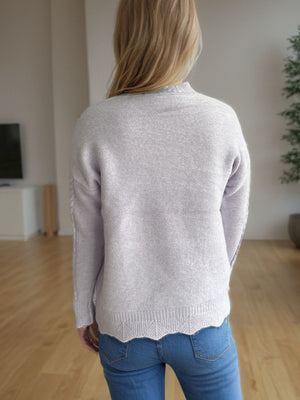 Textured cable knit mock neck pullover in light blue with scalloped hem
