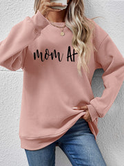Blush pink graphic sweatshirt with black "mom AF" text, crewneck, and long sleeves.