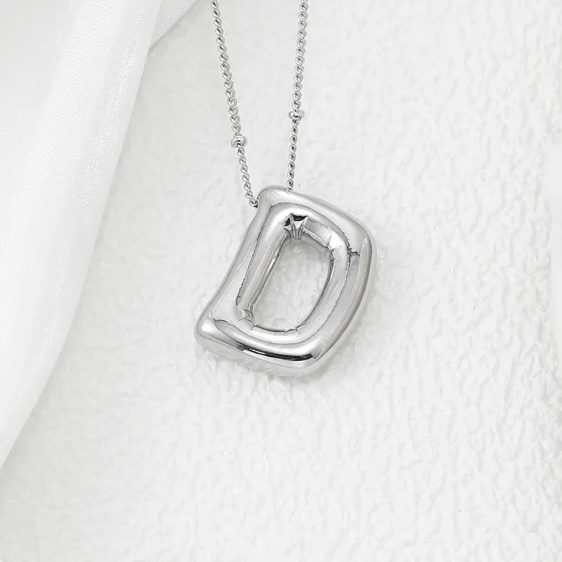 Sculpted initial pendant necklace in Style D with a beaded chain.
