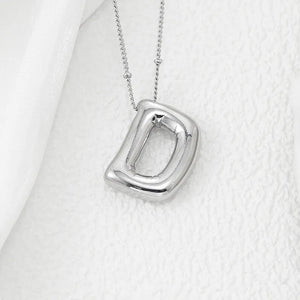 Sculpted initial pendant necklace in Style D with a beaded chain.