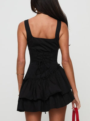 Black mini dress with square neckline, lace-up back, and tiered ruffled skirt.