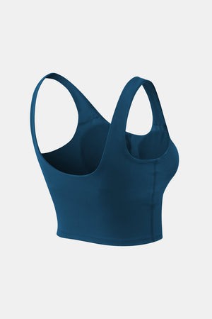 Peacock blue performance scoop crop top with wide straps and a seamless finish.