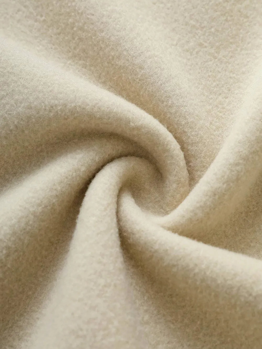 Tan fleece hoodie fabric detail, soft texture, cozy material.