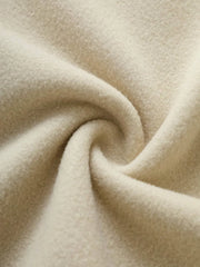 Tan fleece hoodie fabric detail, soft texture, cozy material.