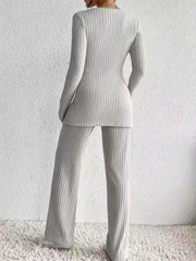 Ribbed knit lounge set in light gray, featuring a long sleeve top and wide leg pants.