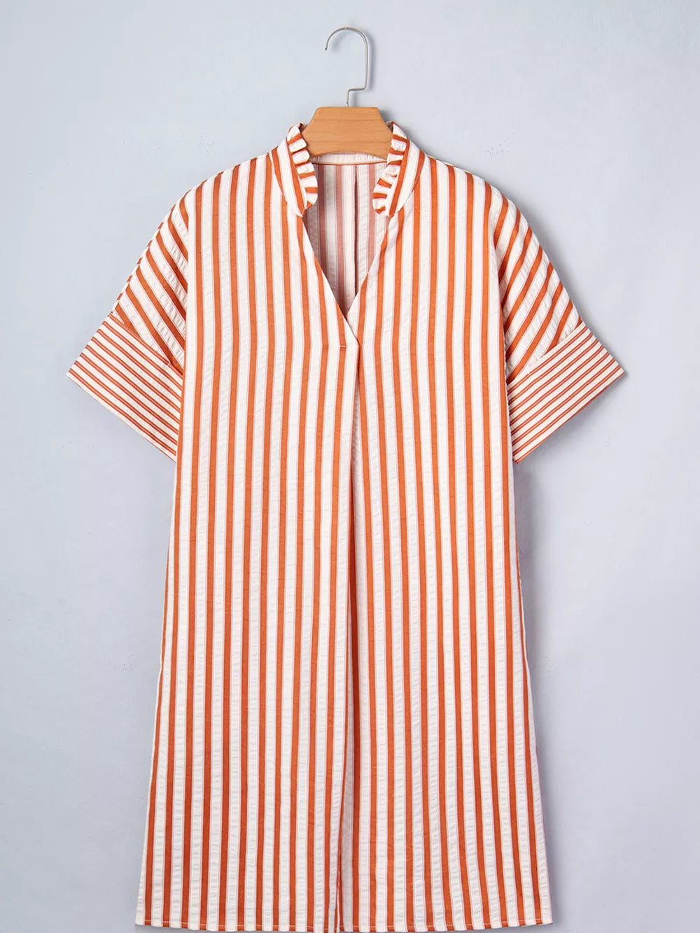 Striped V-neck shift mini dress with short sleeves and a relaxed fit.